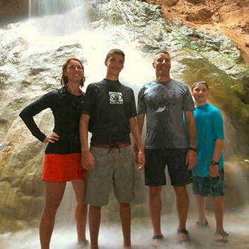 A group of friends rafting down the Grand Canyon