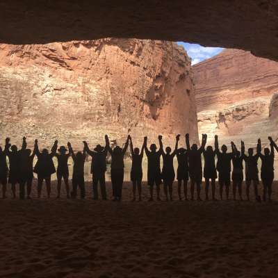 Group Holding Hands in Cave